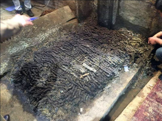 Archaeologists excavated 10 tons of coins in the 2,000 year old tomb