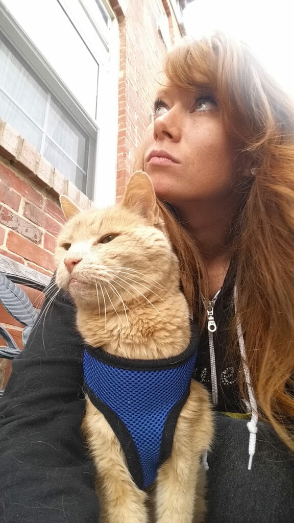 A woman embraces a 21-year-old cat abandoned by his owner, offering him the best days of his remaining life in a loving forever home. - Lillise