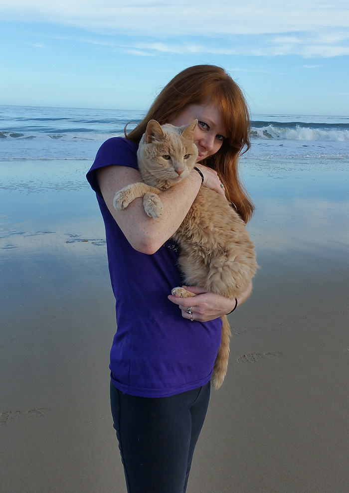 A woman embraces a 21-year-old cat abandoned by his owner, offering him the best days of his remaining life in a loving forever home. - Lillise