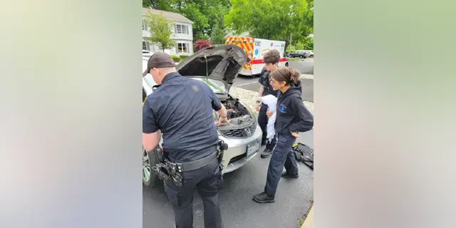 A police officer rescues a kitten from a car engine and decides to adopt him, granting him a forever home filled with love and care. - Lillise