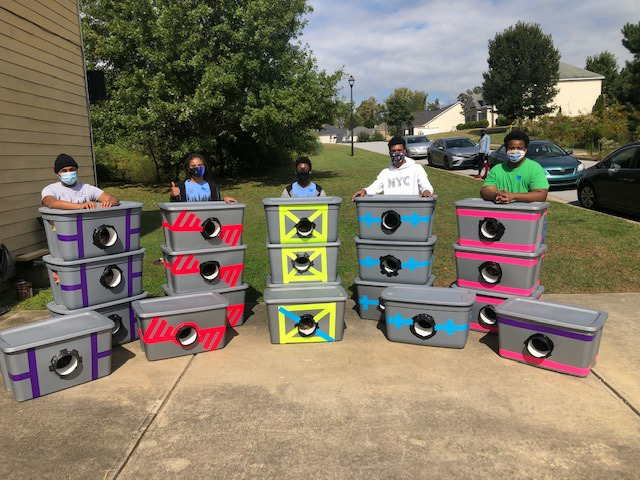 Boy scouts show kindness and compassion by creating shelters from storage totes to save stray cats from winter weather. - Lillise