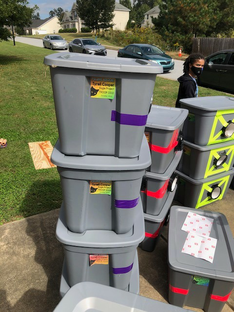 Boy scouts show kindness and compassion by creating shelters from storage totes to save stray cats from winter weather. - Lillise