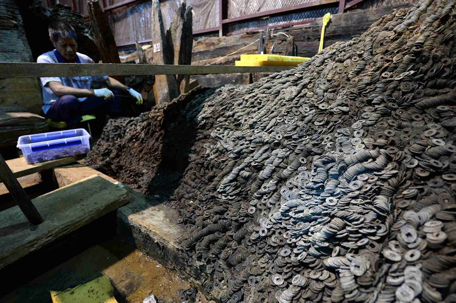 Archaeologists excavated 10 tons of coins in the 2,000 year old tomb