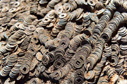 Archaeologists excavated 10 tons of coins in the 2,000 year old tomb