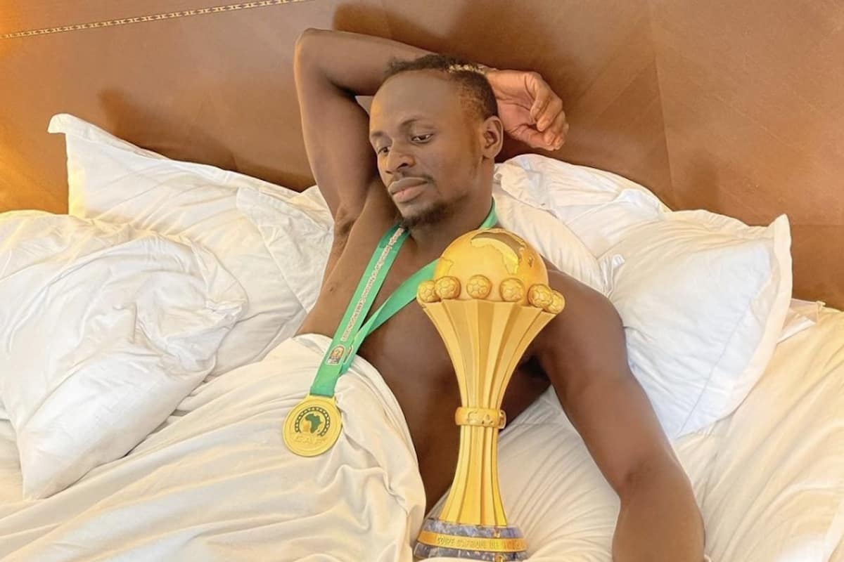 pp.Sadio Mane: Liverpool conductor cradles the trophy in his sleep, celebrating Senegal's glorious Afcon victory, delighting fans.p - LifeAnimal