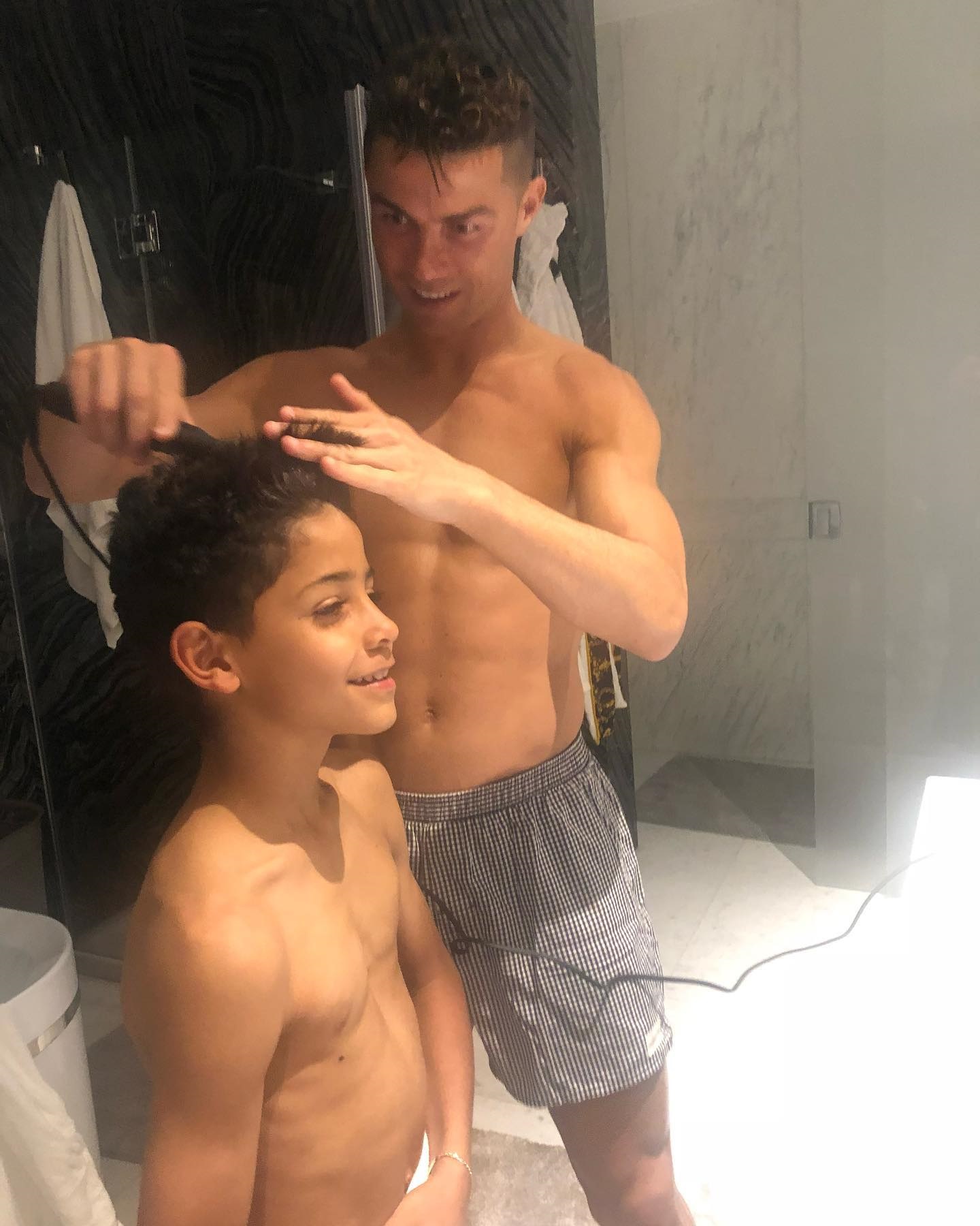 Ronaldo's Family Time: Never-Before-Seen Photos of Football Star Cutting Son's Hair