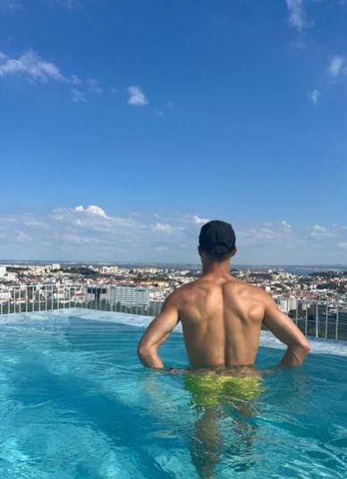 Georgina Rodriguez shows off personal new tattoo as she enjoys rooftop pool in Portugal with boyfriend Cristiano Ronaldo - Buzz News