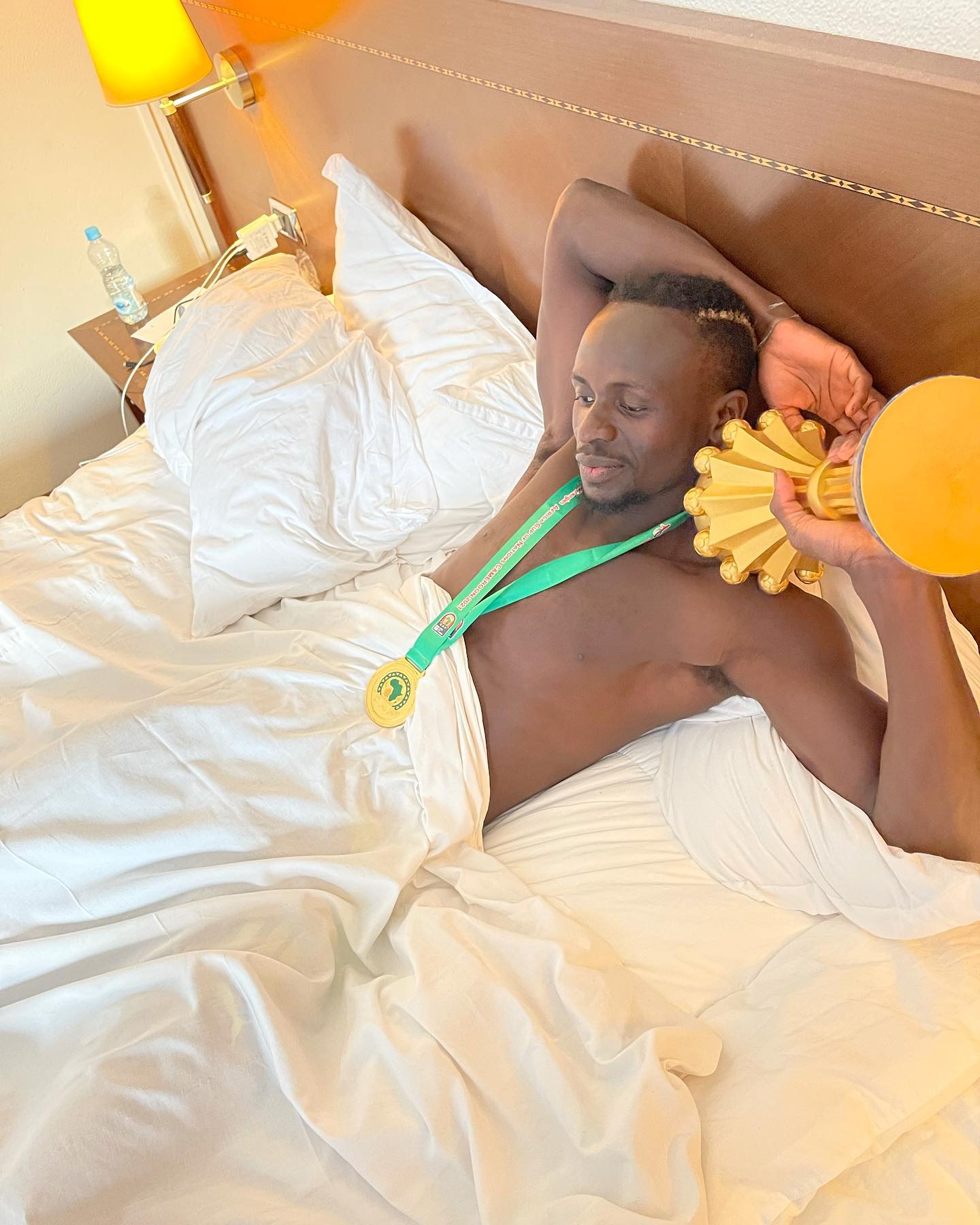 pp.Sadio Mane: Liverpool conductor cradles the trophy in his sleep, celebrating Senegal's glorious Afcon victory, delighting fans.p - LifeAnimal