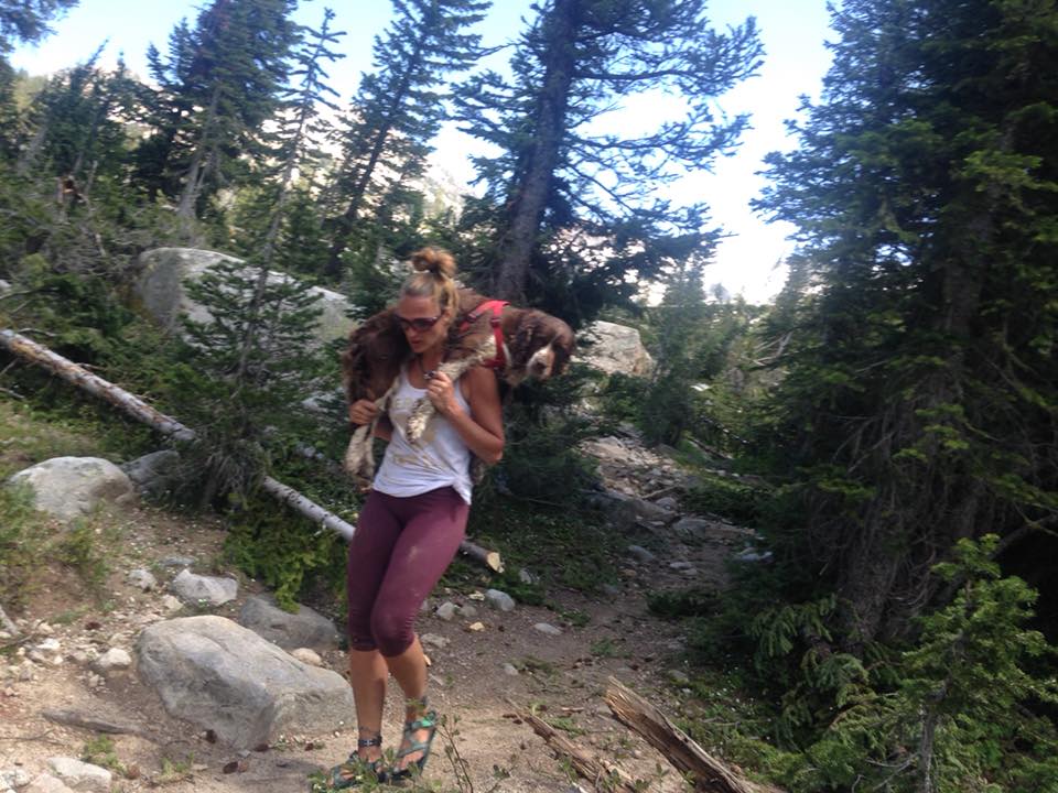 A woman shows incredible strength and compassion by carrying a 55-pound injured dog on her shoulders down a mountain for six hours, demonstrating the lengths we will go for animals in need. - Lillise