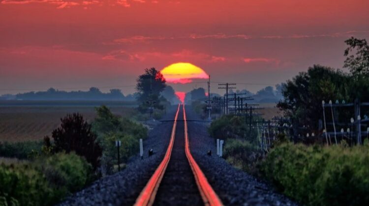 The Celestial Illusion: Entrancing the Senses with the Annual Dance of Sunlight on Railroad Tracks