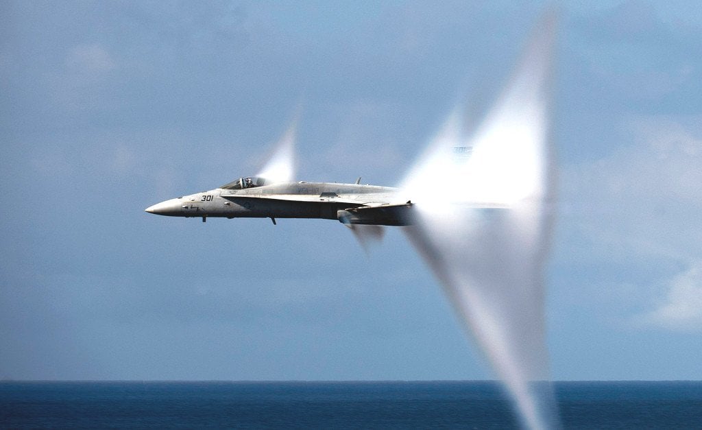 The F14 Tomcat reaches the speed of sound, producing a stunning vapor cone.