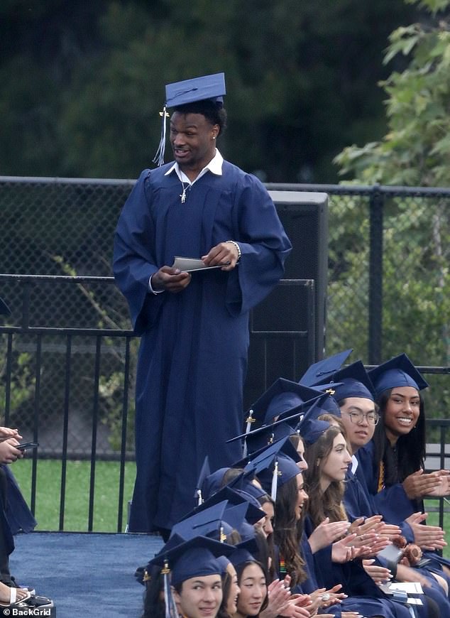 LeBron James plays the role of doting dad as he and wife Savannah watch son Bronny graduate from high school - Sports News