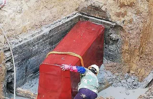 A Villager Uncovers an Ancient Coffin with a Warning Engraved Above, Instilling Fear and Respect Amongst the Community During House Building.