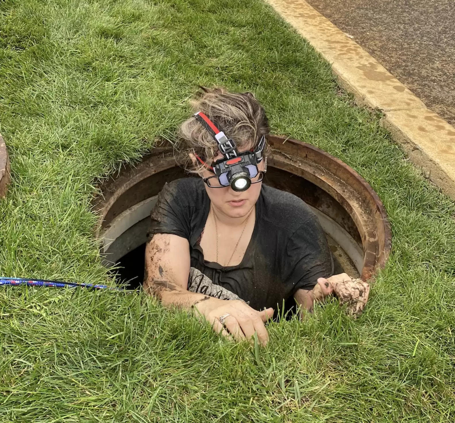 Lone Kitten Stuck in Drain Pipe Gets Help and is Reunited with Her Cat Family