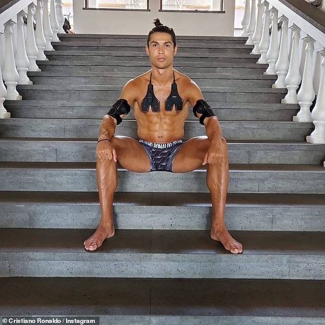 Shirtless Cristiano Ronaldo shows off his rippling abs and lockdown man bun wearing his own brand of underwear as he promotes training gear
