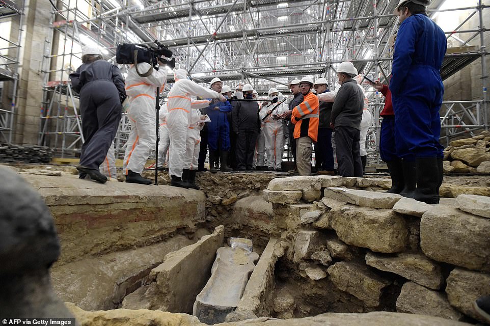 Ancient tombs and a leaden sarcophagus dating back to the 14th century are uncovered at Paris' Notre Dame during work to rebuild the cathedral following damage from the 2019 fire - T-News