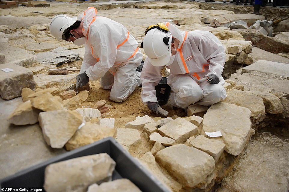 Ancient tombs and a leaden sarcophagus dating back to the 14th century are uncovered at Paris' Notre Dame during work to rebuild the cathedral following damage from the 2019 fire - T-News