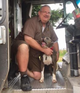 A UPS driver has a heartwarming connection with all the dogs on his delivery route