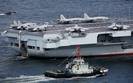 Look at To commemorate its birthday, China's first aircraft carrier, the Liaoning, is in route with 24 J-15 jets.