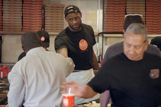 LeShip! Lakers’ LeBron James holds Pizza on the street while ‘GOAT’ pretending to be a delivery guy