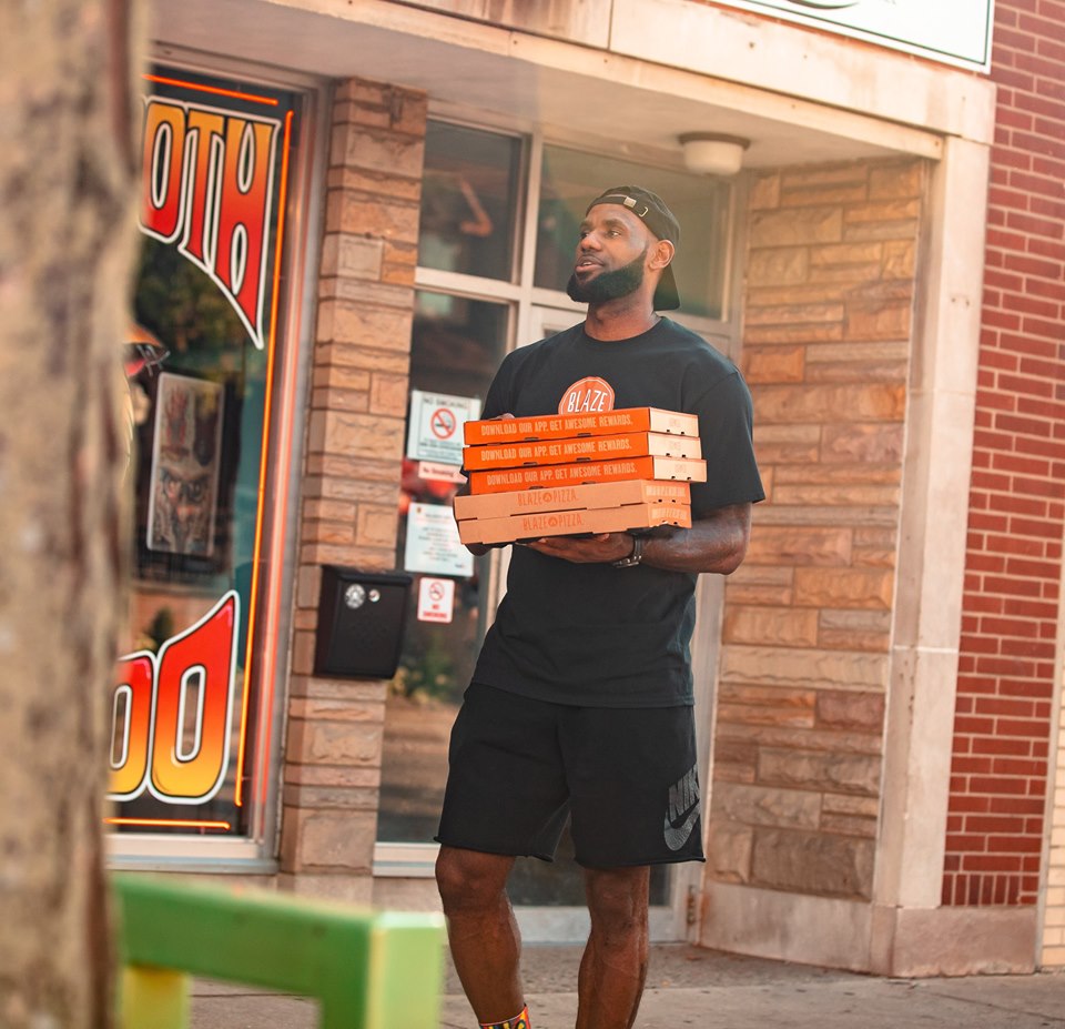 LeShip! Lakers’ LeBron James holds Pizza on the street while ‘GOAT’ pretending to be a delivery guy