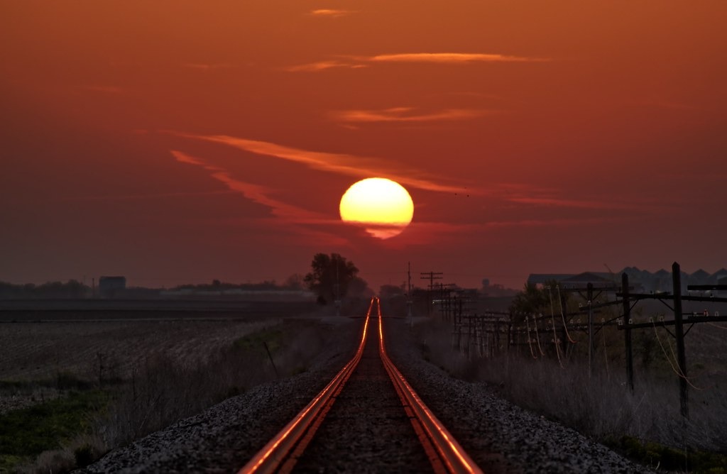 Witness the annual miracle as the sun’s mesmerizing reflection dances upon the railroad tracks, inviting you to capture a photograph that encapsulates the enchantment of this fleeting moment in time.vouyen