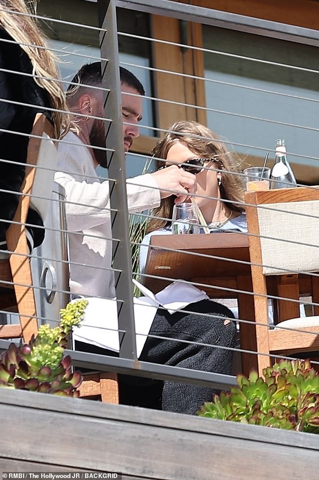 Taylor Swift holds hands with boyfriend Travis Kelce as they enjoy a romantic lunch date at Nobu in Malibu... after returning from Bahamas vacation | Daily Mail Online