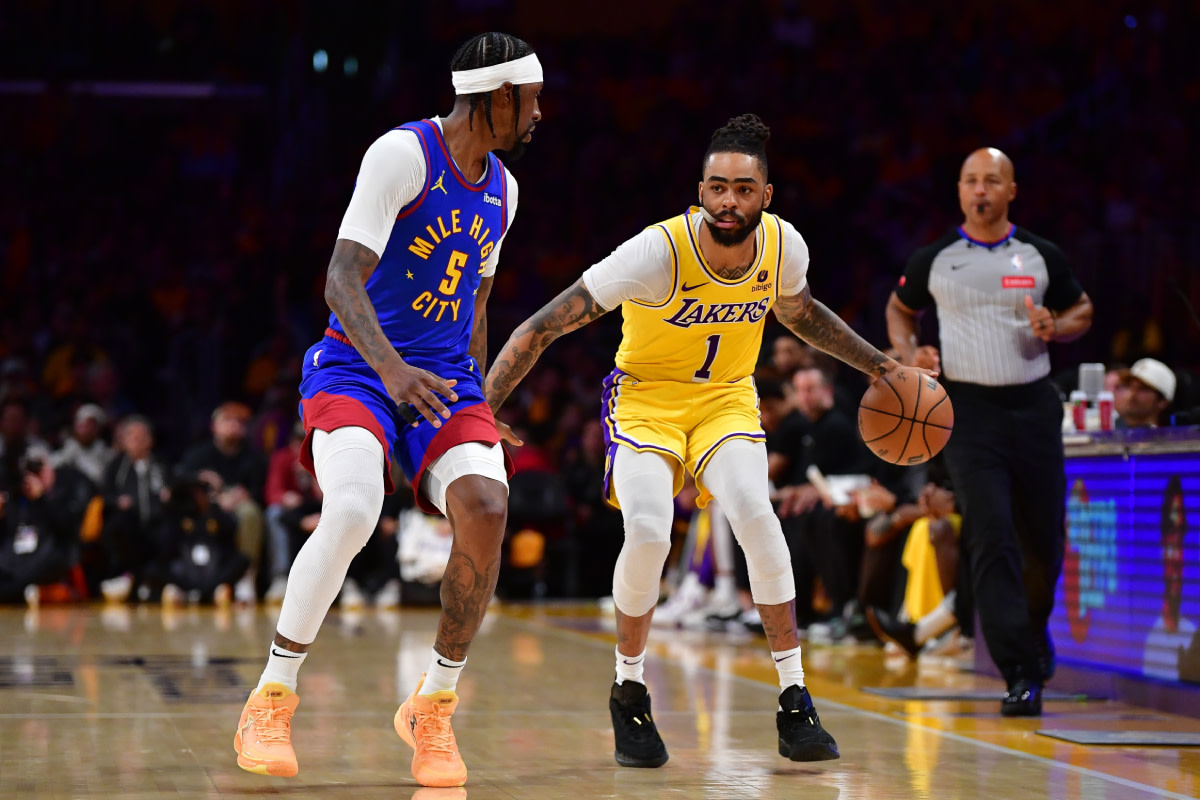Los Angeles Lakers guard D'Angelo Russell (1) moves the ball against Denver Nuggets guard Kentavious Caldwell-Pope (5) during the second half in game three of the first round for the 2024 NBA playoffs at Crypto.com Arena