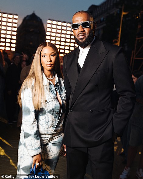 James poses with his wife Savannah at Paris Fashion Week on Tuesday