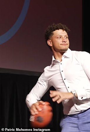 Patrick Mahomes throwing the football to his teammate