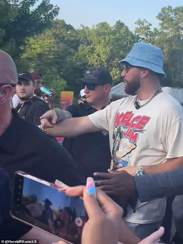 Kelce arrived to his own musical festival in a blue bucket hat and a logo shirt for the event