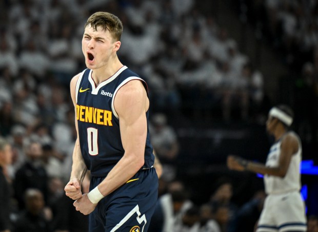 Christian Braun (0) of the Denver Nuggets celebrates making a...