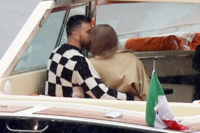 Travis Kelce wrapped his arms around Taylor Swift's waist and shared a passionate kiss as they sat on a boat admiring the scenery.