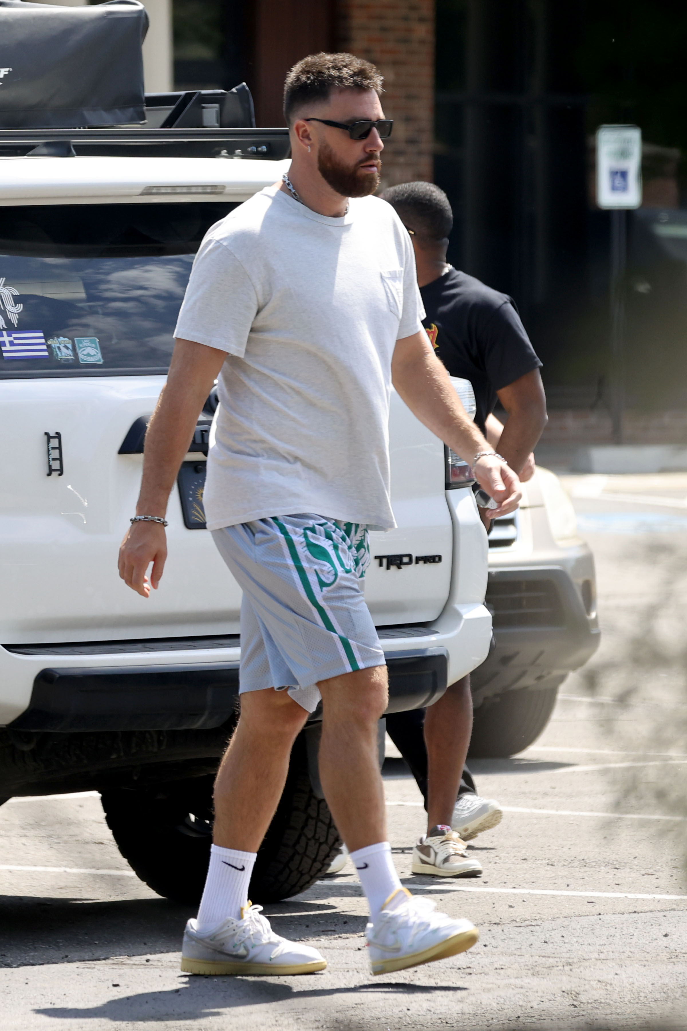 Travis Kelce was spotted back on American soil after vacationing with Taylor Swift