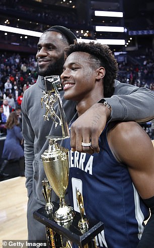LeBron 'Bronny' James Jr. #0 of Sierra Canyon High School with his father LeBron James of the Los Angeles Lakers following the Ohio Scholastic Play-By-Play Classic against St. Vincent-St. Mary High School at Nationwide Arena on December 14, 2019