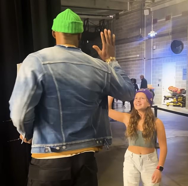 James was also filmed giving her a high-five as the Lakers said the meeting was 'wholesome'