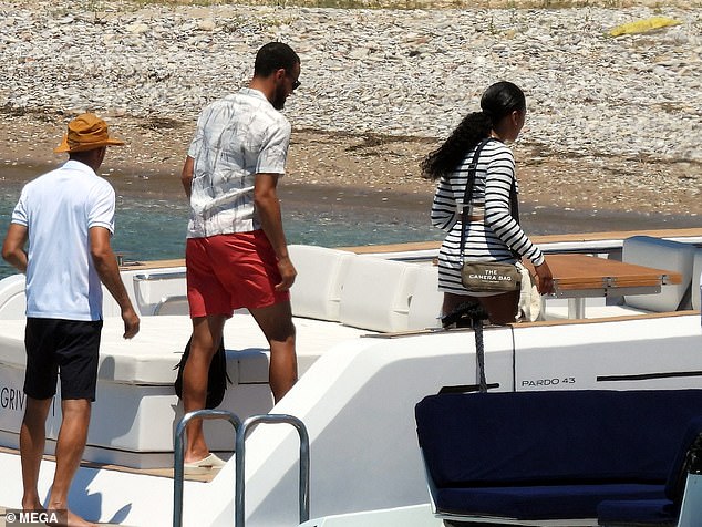 Stephen and Ayesha had unidentified company as they walked onto the boat in Greece